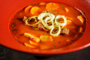 Paprika Kitchen & Bar magyar étterem Budapest Goulash soup Budapest – traditional goulash soup with beef and vegetables